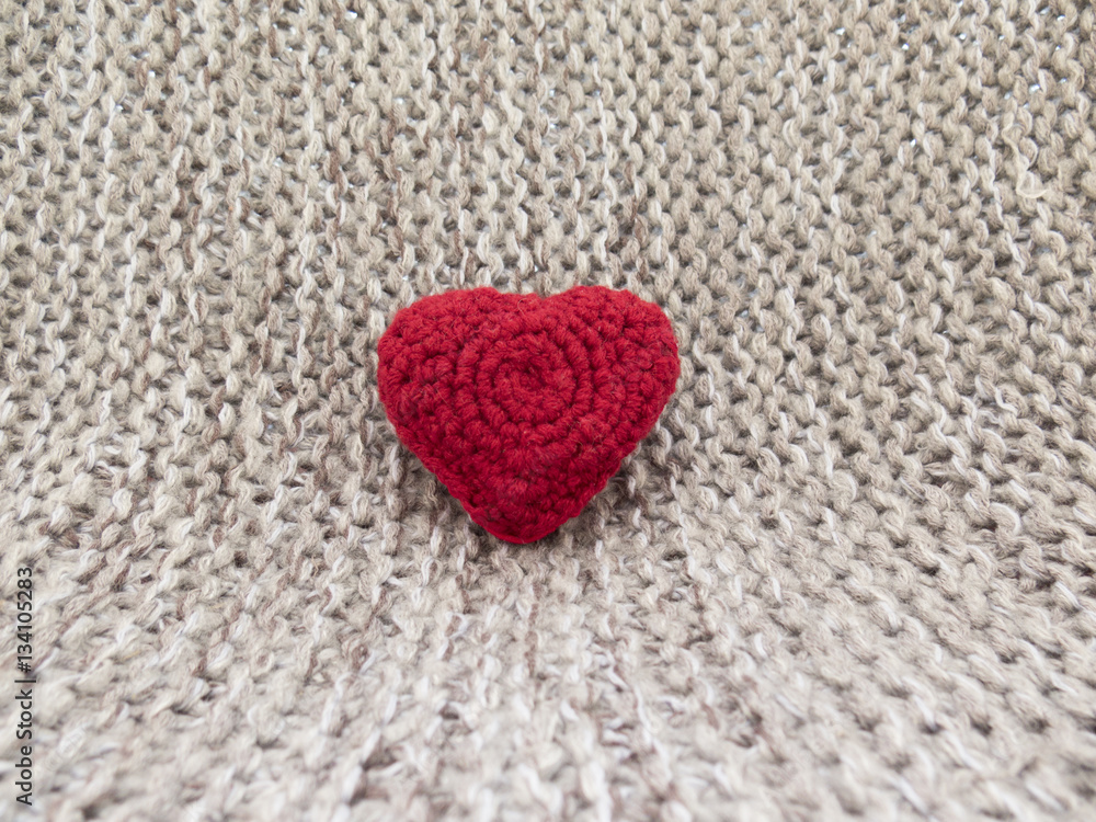 The warm background of the day of all lovers with knit hearts an The warm background of the day of all lovers with knit hearts an