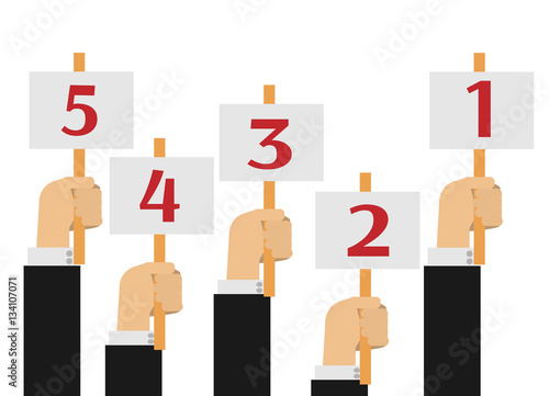 Hands holding score cards