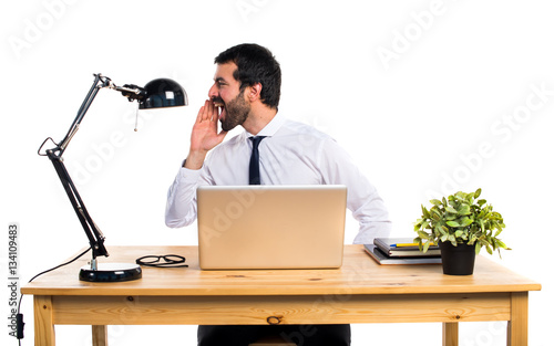 Businessman in his office shouting