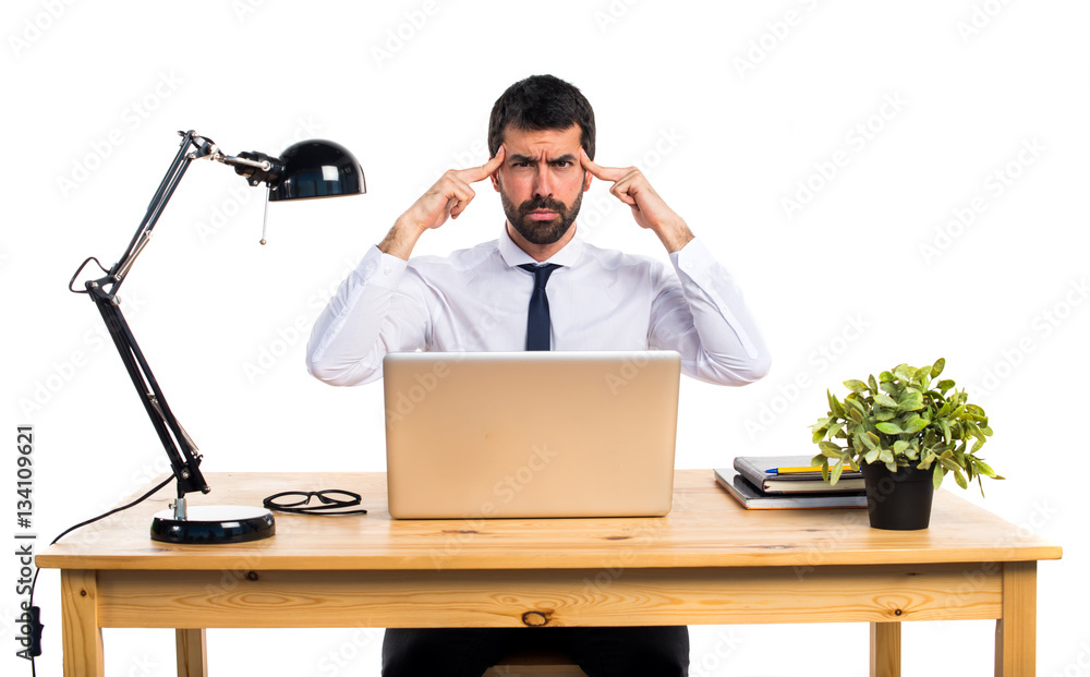 Businessman in his office thinking Businessman in his office thinking
