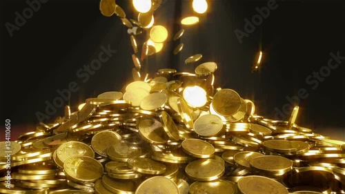 Falling coins. High quality animation of falling coins. This is one dollar gold coins. Animation generated in great 3D physics system. On the top we see the beam of light for mystical atmosphere. photo