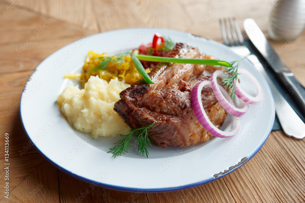 Grilled pork ribs with sauerkraut and mashed potatoes Grilled pork ribs with sauerkraut and mashed potatoes