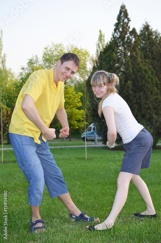 Boy and girl having fun in a meadow