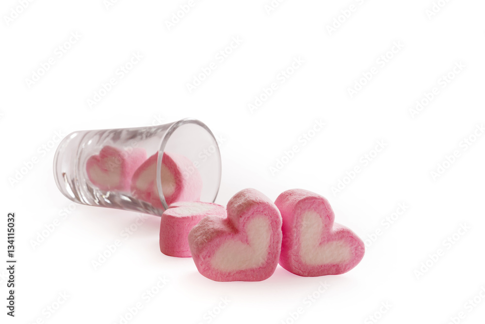 Marshmallow pink heart shape in glass on white background Marshmallow pink heart shape in glass on white background