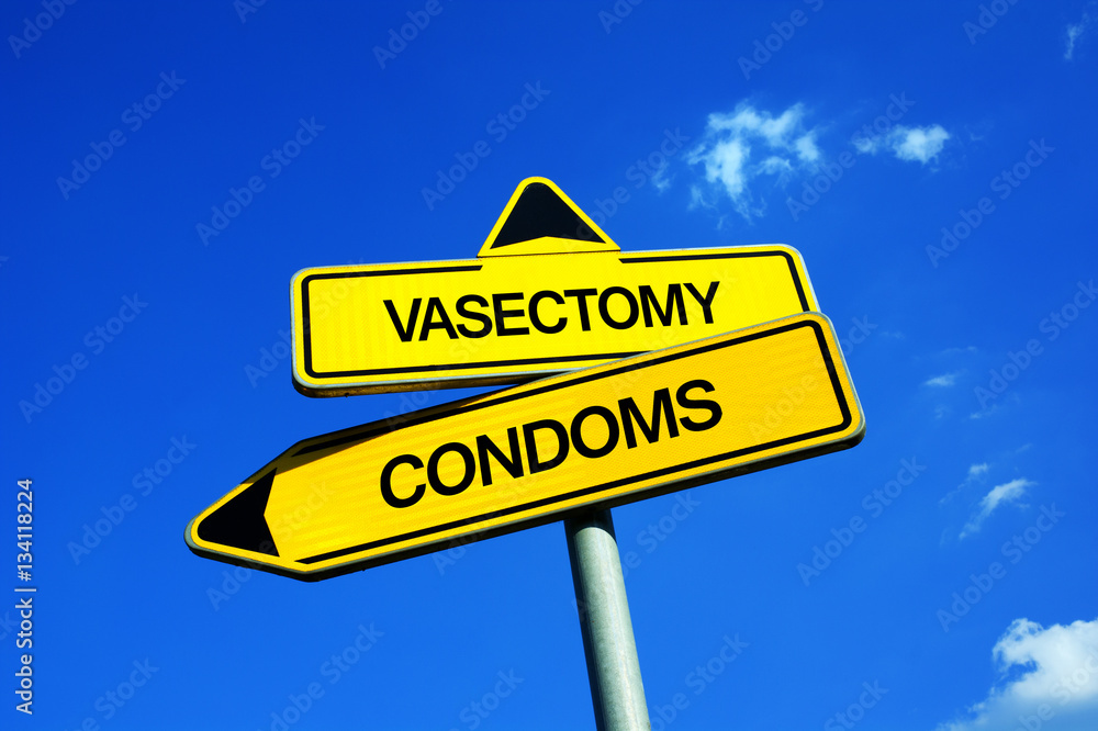 Vasectomy vs Condoms - Traffic sign with two options - male contraception and birth control. Irreversible, permanent and definitive surgery leading to sterilization and infertility vs using condoms Vasectomy vs Condoms - Traffic sign with two options - male contraception and birth control. Irreversible, permanent and definitive surgery leading to sterilization and infertility vs using condoms