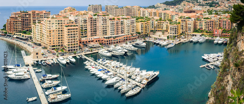 Monte Carlo harbour city panorama. View of luxury yachts and apartments in harbor of Monaco