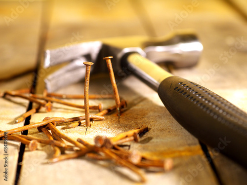old rusty nails and carpenter's hammer, shallow depth of field, selective focus
