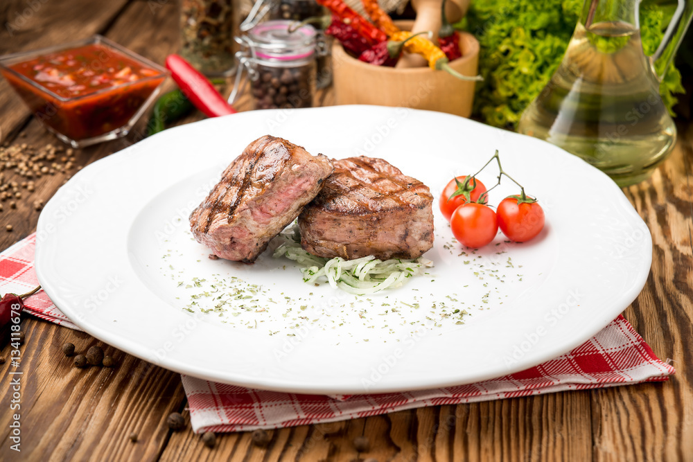 Fried grilled steak and vegetables on a plate Fried grilled steak and vegetables on a plate