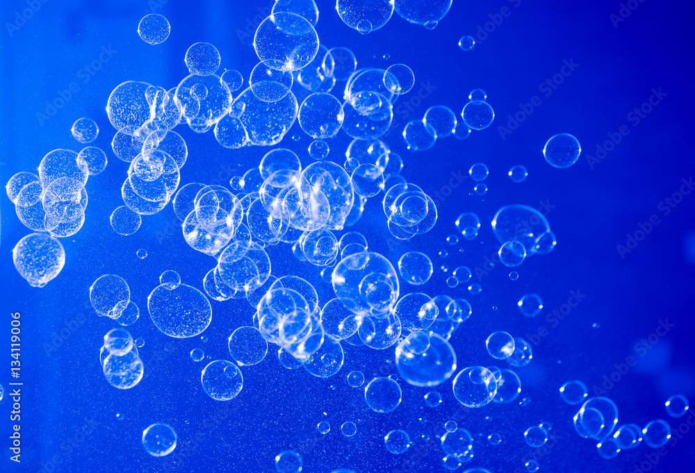 Soap bubbles blue abstract background