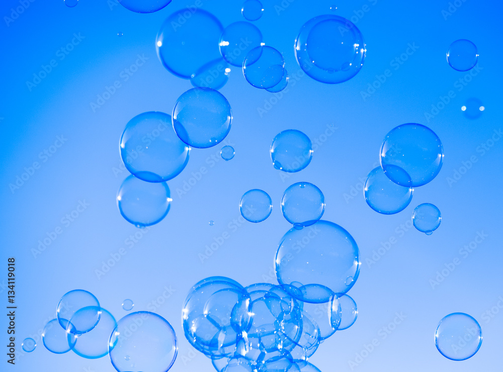 Soap bubbles blue abstract background