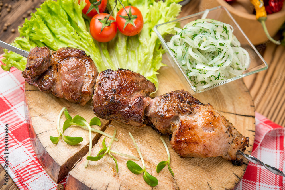 Delicious juicy skewered meat or shish kebabs on skewers of pork tenderloin. Fragrant and spicy dish.