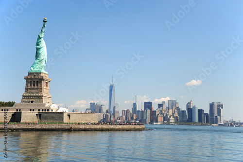 Statue of Liberty on the island and New York Manhattan skyline © nd700