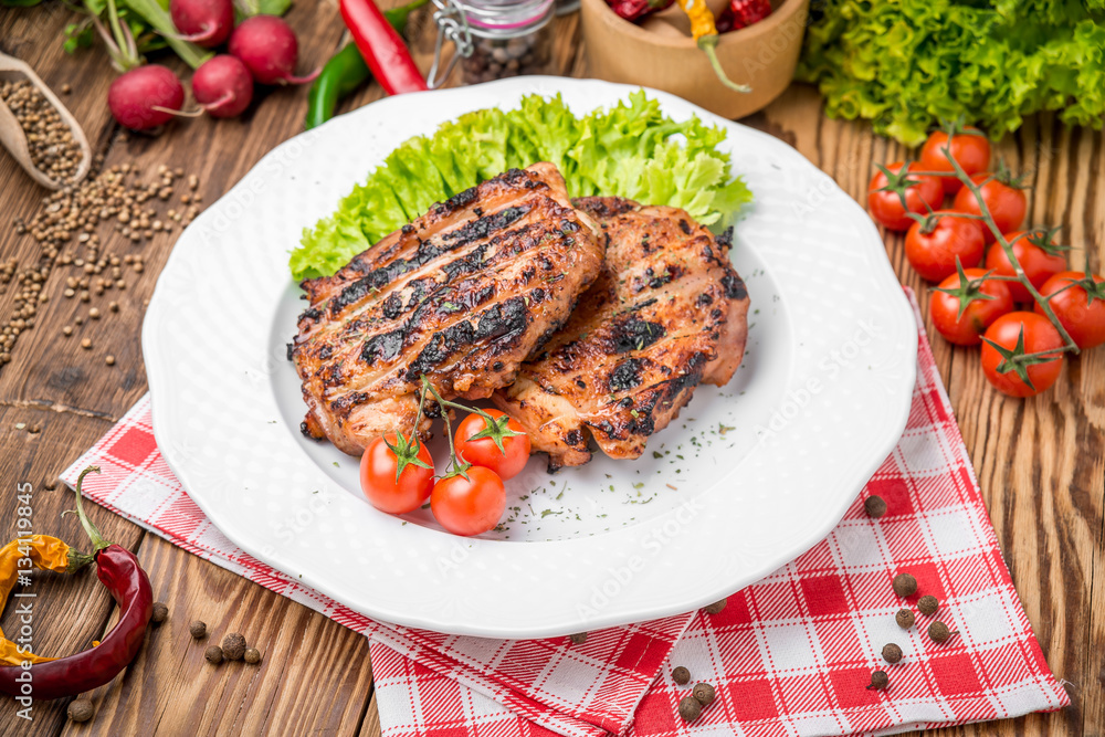 roasted chicken with herbs served on a plate with vegetables roasted chicken with herbs served on a plate with vegetables