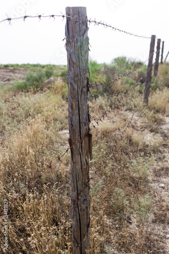 barbed wire fence in the nature