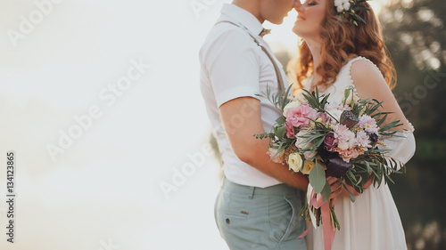 Obraz na płótnie the bride and groom on the background of a mountain stream