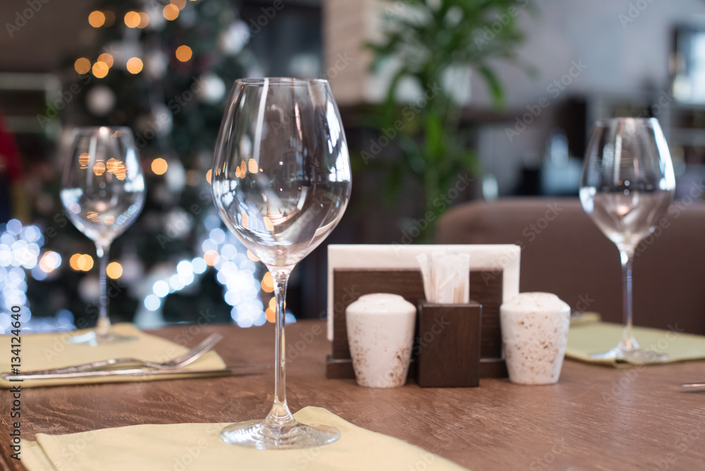 Wine glasses on the table served for dinner in the restaurant Wine glasses on the table served for dinner in the restaurant