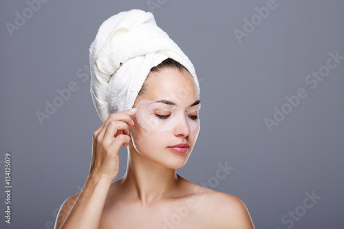 Girl with mask on eyes and towel on head