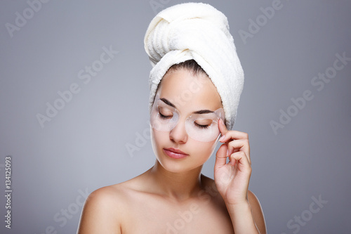 Model with mask on eyes and towel on head