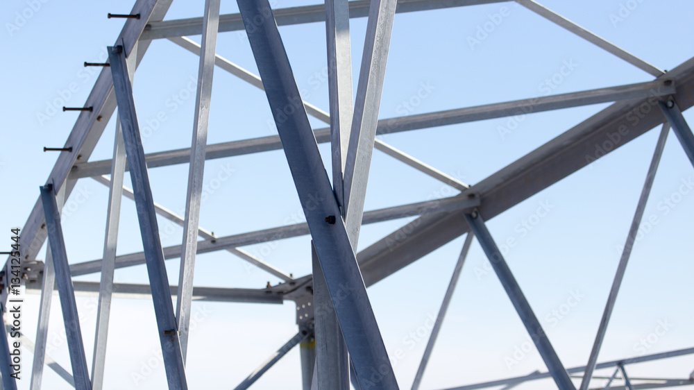 metal construction on a background of blue sky metal construction on a background of blue sky