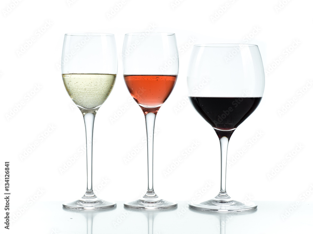 Glasses of red, white and rose wine on a white background Glasses of red, white and rose wine on a white background