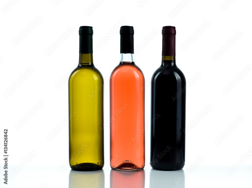 Bottles of red, white and rose wine on a white background