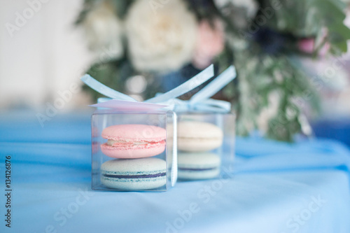 Wedding decor in the restaurant, bonbonnieres, candy boxes, macaroon