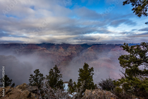 Fog flowed through the Grand Canyon much like the turbulent waters of the Colorado River below.