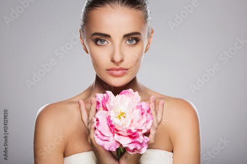 Beautiful model with big pink flower
