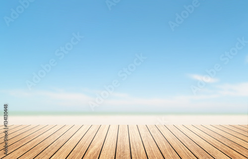 Wood floor with cloudy summertime background.