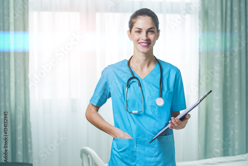 фотографія woman doctor or nurse standing in hospital room