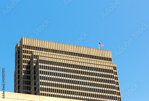 Skyscraper with US flag on roof