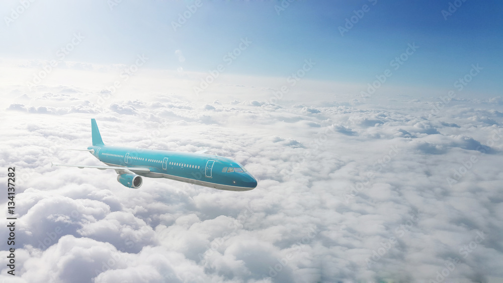 Commercial jet flying over clouds Commercial jet flying over clouds