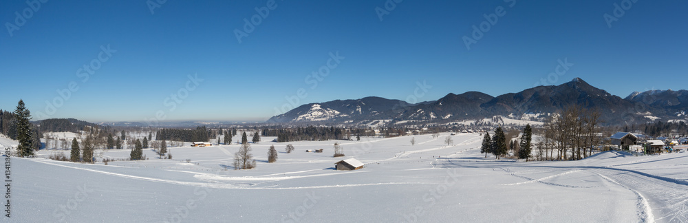 Panorama view into a Bavarian valley on a sunny winter day