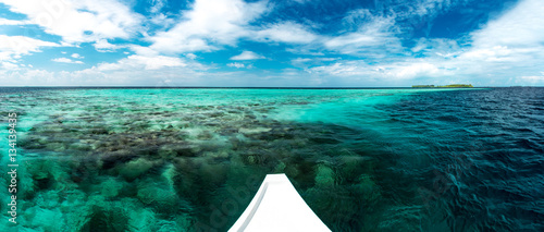 Fototapeta Naklejka Na Ścianę i Meble -  White yacht at clear ocean near coral reef, nature landscape