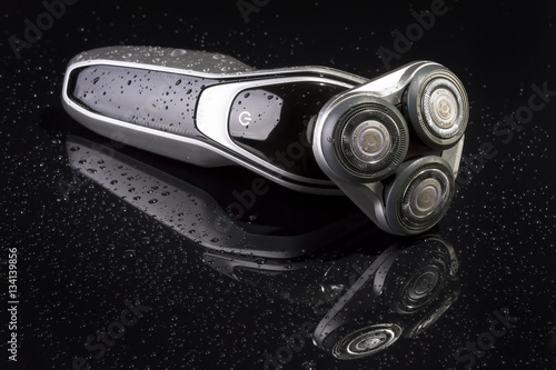 Electric shaver closeup on black background