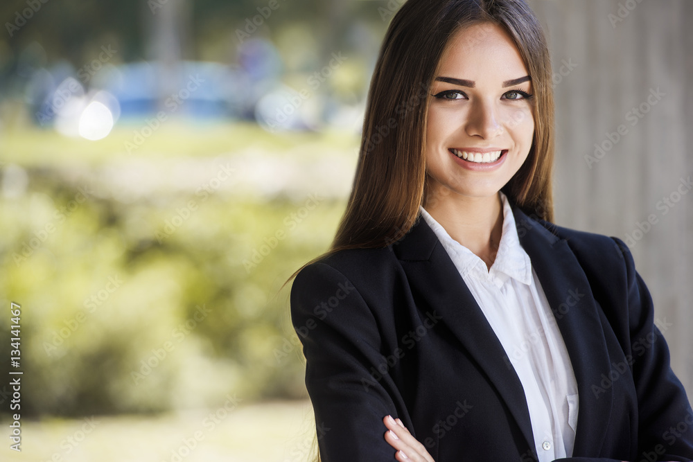 Beautiful young business woman, smiling, close up portrait. With copy space. Beautiful young business woman, smiling, close up portrait. With copy space.