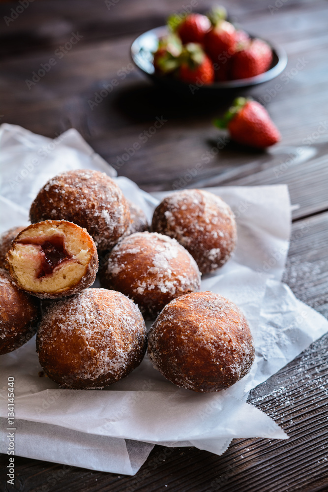 Bomboloni - Italian doughnuts stuffed with strawberry jam Bomboloni - Italian doughnuts stuffed with strawberry jam