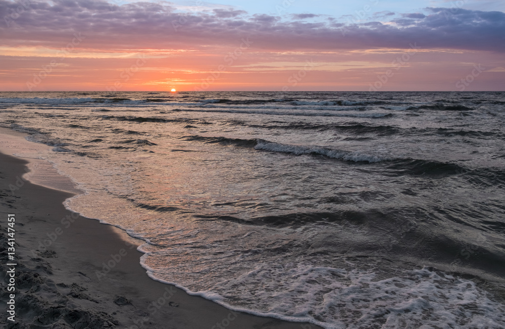 Sunset on Baltic Sea white dramatic sky and rough sea Sunset on Baltic Sea white dramatic sky and rough sea