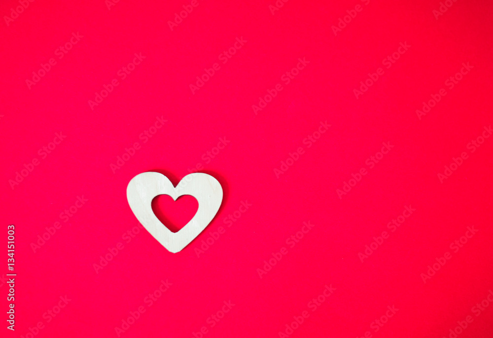wooden heart on a pink background