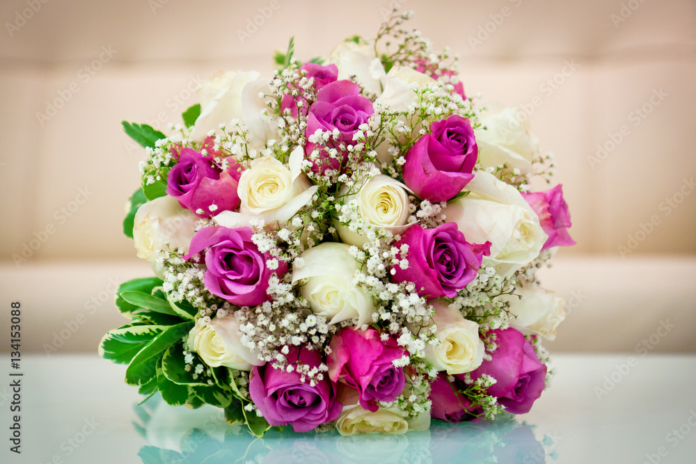 Wedding flower bouquet for the bride in white and purple roses Wedding flower bouquet for the bride in white and purple roses