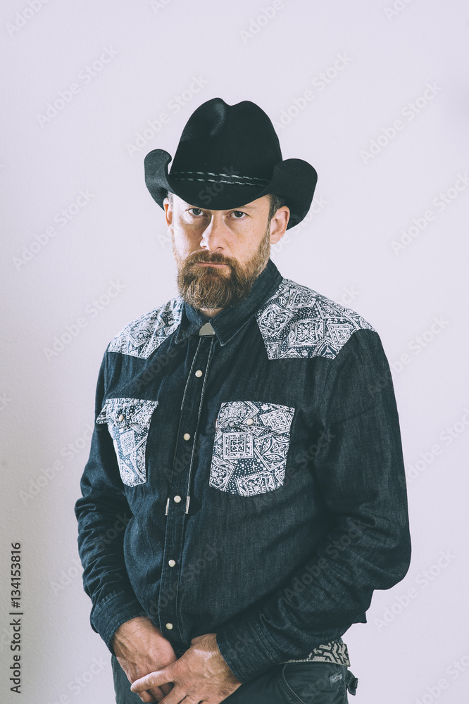Portrait of cowboy with beard and hat Portrait of cowboy with beard and hat