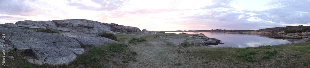 Obraz premium Sunset panorama with stony beach near Verdens end in Norway