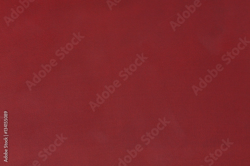 Texture of red leather on macro.