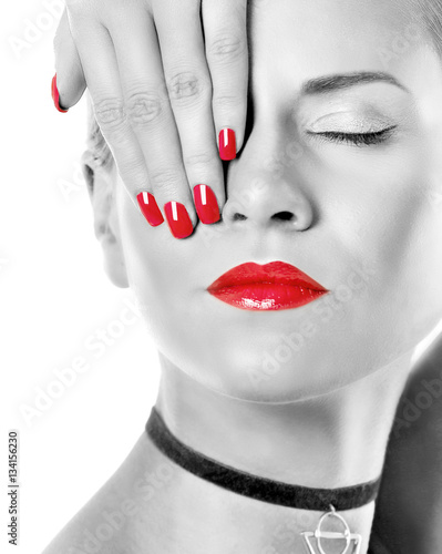 Young woman with color accent in makeup on white background