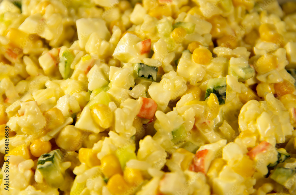 Salad with crab sticks corn cucumber eggs and rice Salad with crab sticks corn cucumber eggs and rice