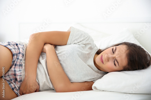Young woman with stomach ac...