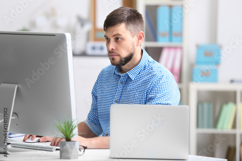 Handsome young programmer w...