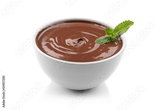 Foto Chocolate mousse with mint in dessert bowl on white background