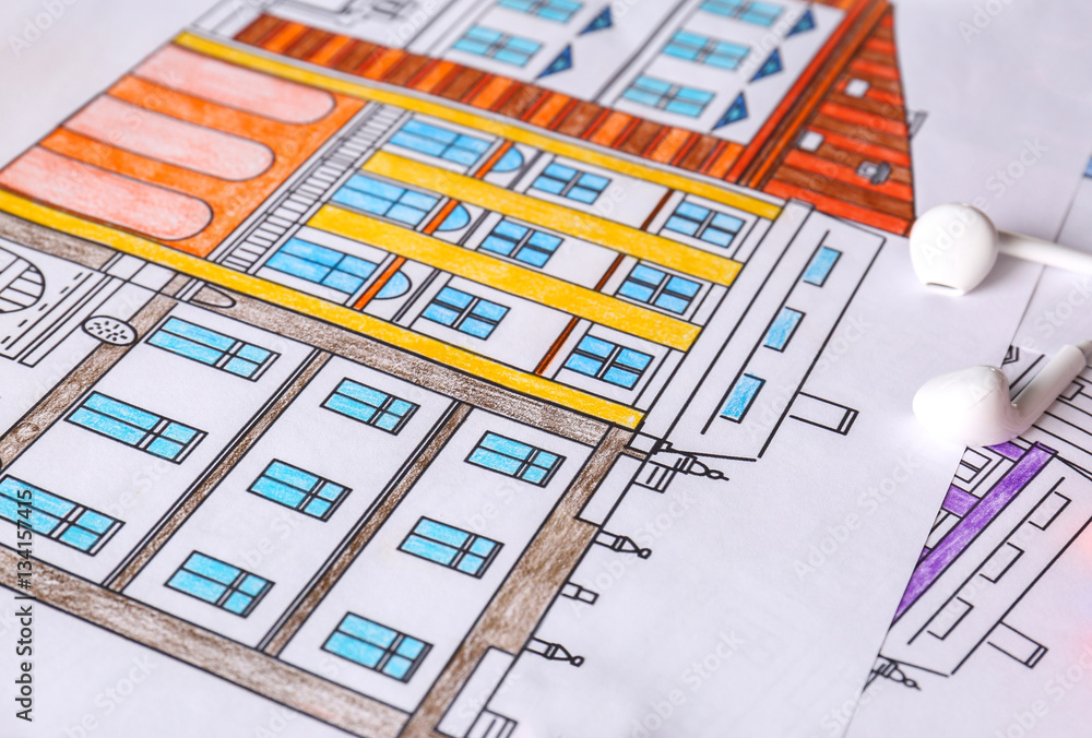 Close up view of colouring pictures on table Close up view of colouring pictures on table