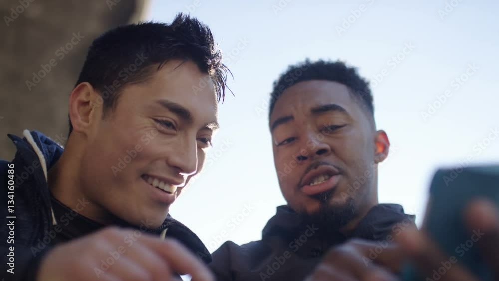 4K Personal trainer shows client his progress and both are pleased, in slow motion 